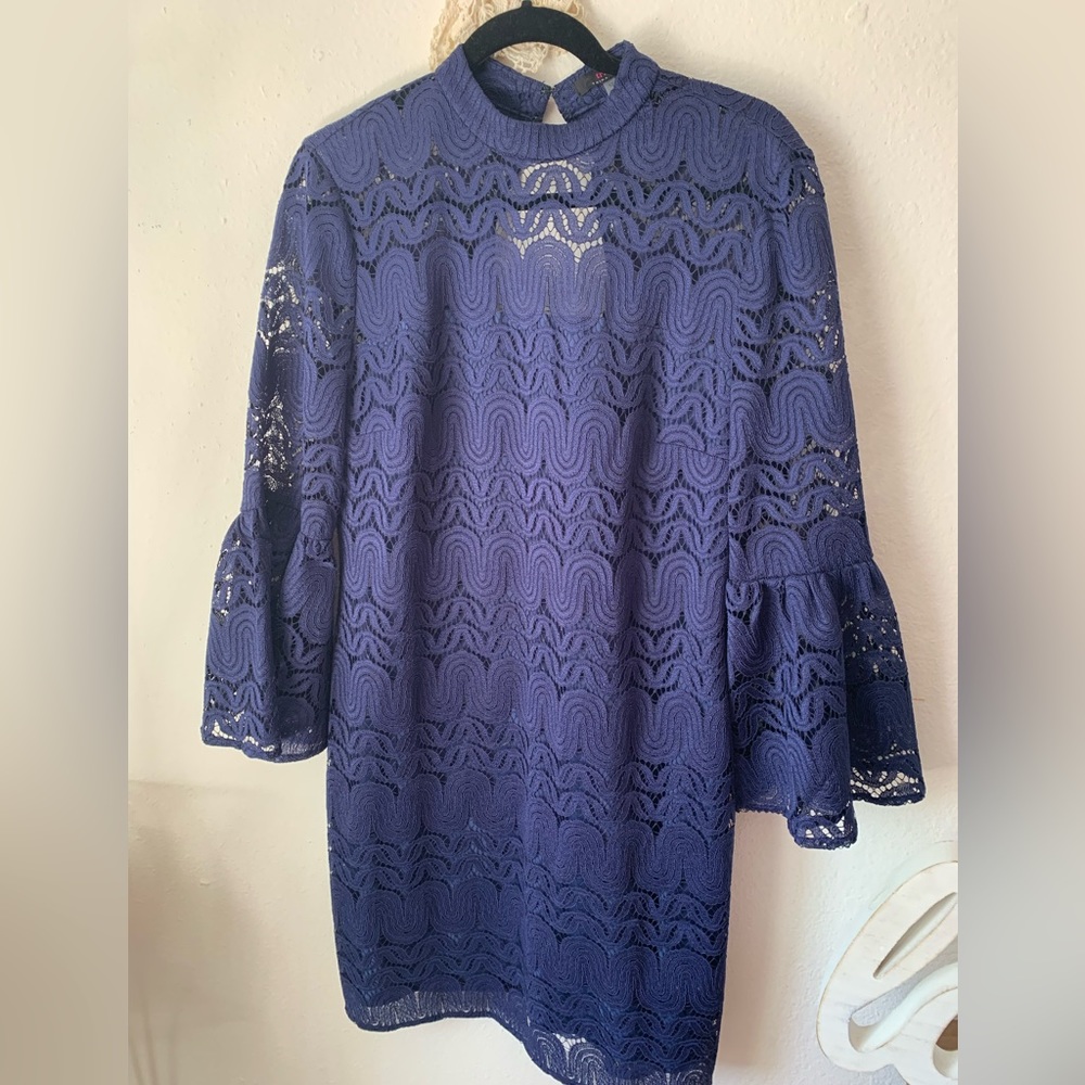 Lovely Trina Turk navy blue occasion dress with fun ruffle sleeve.